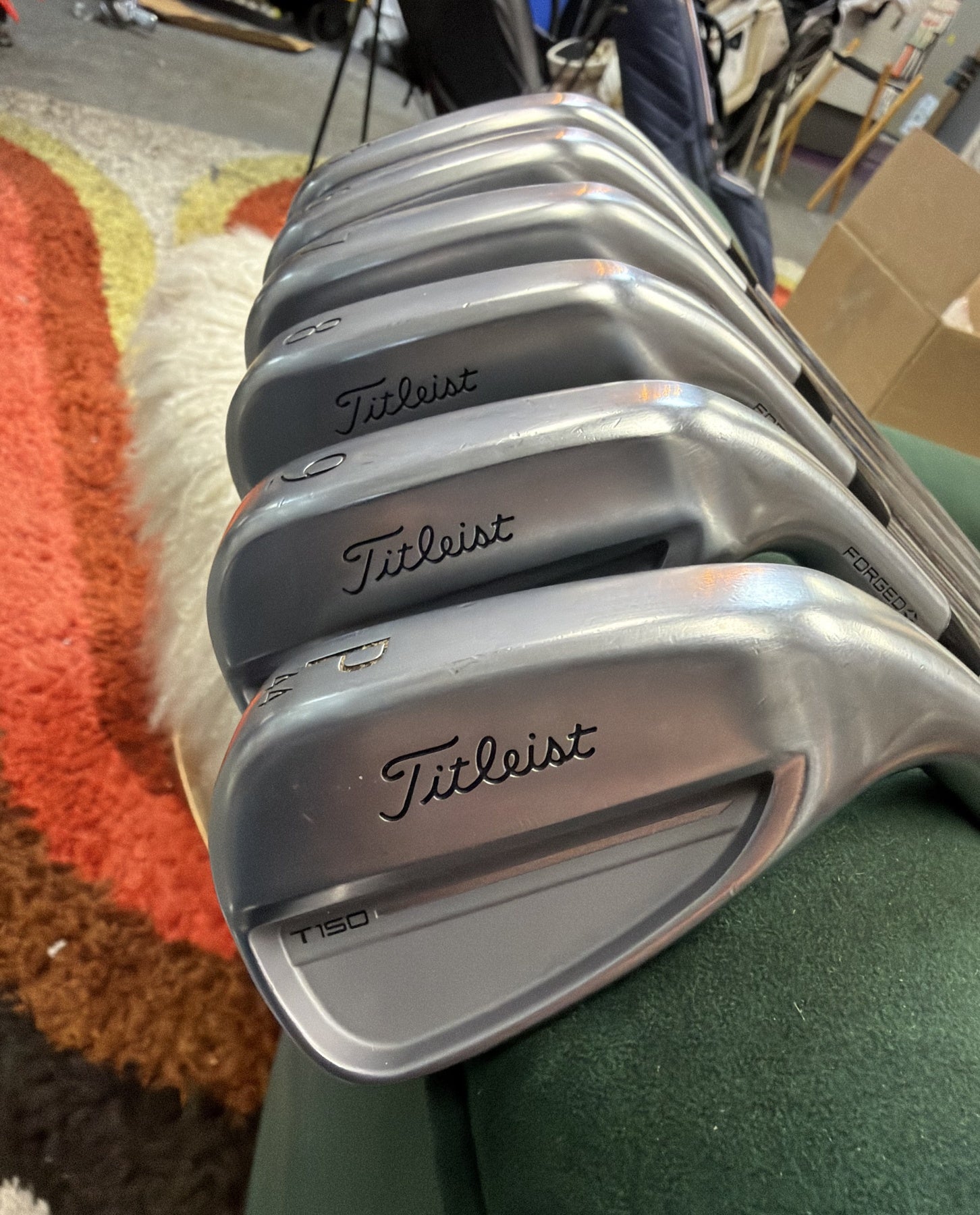 Titleist T150 Irons | 5-PW | Nippon MODUS3 Tour 115 X - actual club photograph with original background